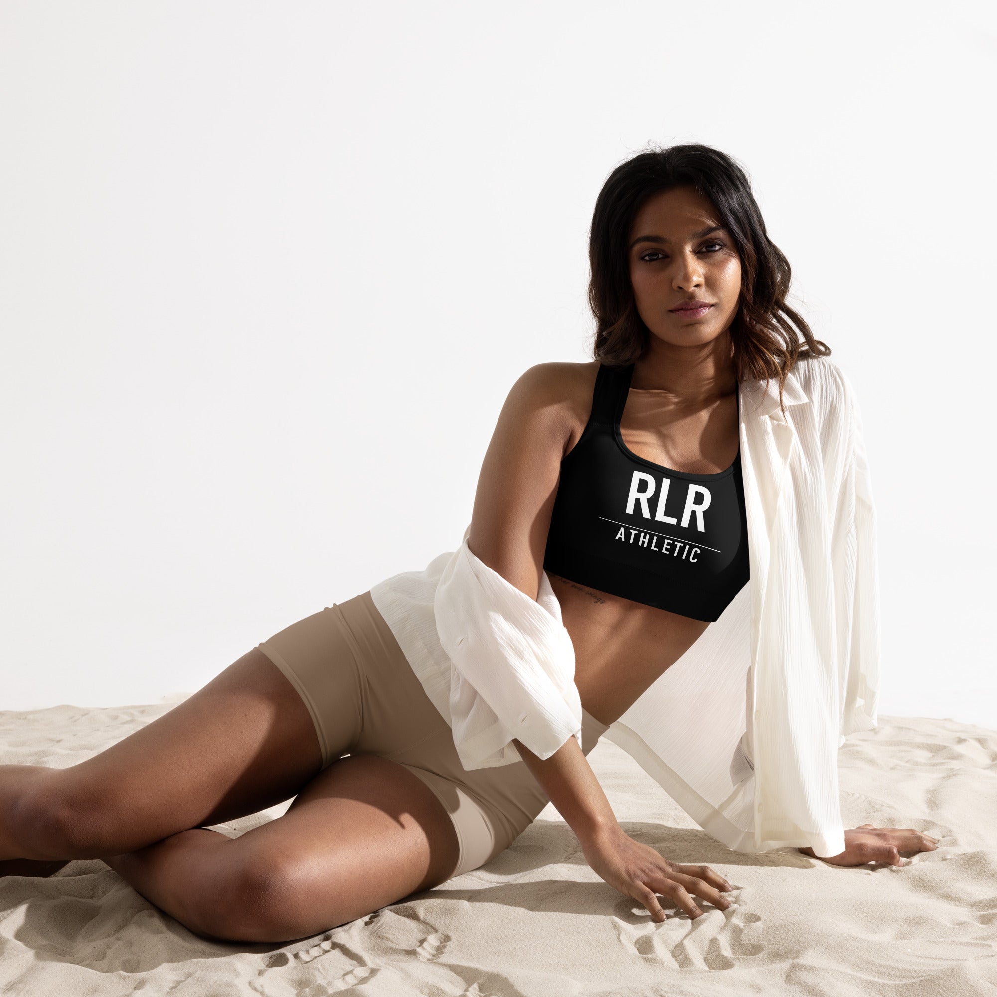 Athlete wearing the black RLR Padded Training Bra in a light studio setting
