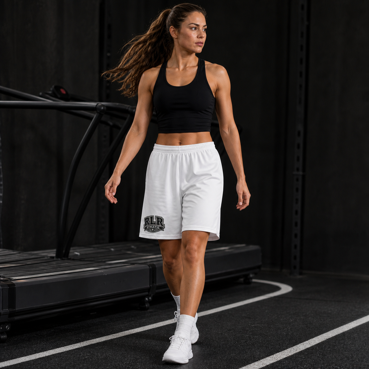 Female athlete wearing white RLR Athletic Longline Training Shorts in a gym